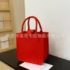 Nuevo Bolso de Mano de Fieltro de Dibujos Animados Bolso Tote Souvenir de Boda para Bebé Bolsa de Fieltro Bolsa de Regalo de Promoción Publicitaria