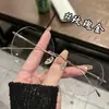 Armazón de Gafas Danyang de Moda Liso Adelgazante Poligonal Anti Luz Azul Ultraligero de Titanio Puro Sin Montura Cortado al Borde para Miopía para Mujeres