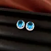 Set de aretes, collar y anillo de circonia con aguja de plata transfronterizo, joyería de alta gama de lujo ligero con un toque exquisito y elegante