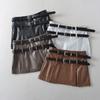 Falda de cuero PU negra estilo retro americano para mujer, nueva falda mini de cintura alta con doble cinturón de otoño