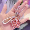 Llavero de estrella de cinco puntas con diamantes completos de dibujos animados coreanos lindo borla para hombres y mujeres colgante de anillo para llavero de bolso venta al por mayor