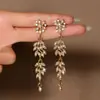 Pendientes de Aleación de Moda Europeos y Americanos Exagerados con Borla Larga y Pedrería para Mujer Moda Ins Lujo Ligero Pendientes de Botón de Nicho