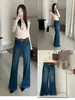 Jeans acampanados de otoño TOP estilo europeo de Guangzhou Trece Líneas vintage de alta resistencia con pliegues elásticos 360 grados con cinturón 61828