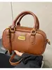 Bolsa de Boliche Portátil Simples Retrô para Mulheres 2026 Versão Coreana Bolsa Transversal Almofadada para o Trabalho Bolsa de Ombro Casual da Moda