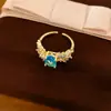 Anillo abierto de flor ovalada de circón bañado en oro real de 18 quilates, sensación de nicho de alta gama, joyería exquisita de lujo ligero