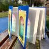 Carimbo de projeção de transmissão de luz este relógio de atração turística personalizado Taicang cenário de filme capítulo documento de desembaraço aduaneiro livro livro de luz e sombra