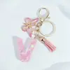 Suministra y Vende Llaveros con Alfabeto de 26 Letras en Forma de Corazón Rosa con Borlas de Mariposa, Colgantes para Llaves y Colgantes para Bolsos de Mujer