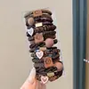 Nuevas diademas de alta gama 2026 para mujer, ligas de goma, cordones para el pelo, anillos para el pelo, cubiertas de cuero, accesorios para el pelo de niña con un toque de sofisticación