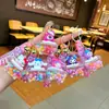 Chaveiro de urso morango de desenho animado garrafa de areia movediça garrafa de líquido de óleo banheira garrafa flutuante pingente de chave de pvc acessórios de bolsa
