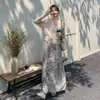 Traje Estilo Bohemio Retro para Mujer 2026 Primavera y Verano Nuevo Estilo Elegante Blusa con Cortes Falda Estampada Conjunto de Dos Piezas
