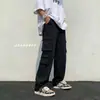 Calça casual longa multi-bolsos estilo japonês para homens, calça jogger funcional de cor sólida com cordão versátil para outono e inverno
