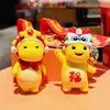 Llavero genuino Xingshi leche año del Dragón llavero femenino creativo Wu Dios de la Riqueza llavero colgante para mochila regalo de Año Nuevo al por mayor