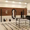 Estante de exhibición para tienda de ropa acero inoxidable negro montado en la pared perchero para colgar ropa oferta especial del comprador estante de exhibición de ropa estante para tienda de ropa de mujer