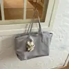 Bolsa tote de cor sólida nicho estilo coreano Shuai Mijia para mulheres, novo modelo 2026, bolsa de mão e bolsa de ombro de grande capacidade na moda para o trabalho