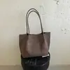 Bolsa tote casual de grande capacidade, cor sólida, nova versão coreana outono 2026, bolsa de mão e bolsa de ombro personalizadas para trabalho e deslocamento