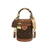 Bolsa feminina estilo balde da moda, alto valor estético, bolsa de mão de luxo discreto e nicho, bolsa redonda pequena estilo balde da sorte estilosa, bolsa de ombro e transversal