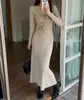 Vestido de punto plisado ajustado de diseño francés para Otoño e Invierno, suéter base liso elegante para mujer, falda larga