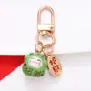 Estilo Chino Atrae Fortuna Cerámica Gato de la Suerte Llavero Colgante Estuche para Auriculares Bolso Encanto Accesorio Adornos Pequeños Venta al por Mayor