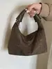 Bolso transfronterizo para mujer, bolso de hombro de moda y tendencia para el día a día, bolso de axila, bolso para lonchera, nuevo bolso tejido versátil y cómodo 2026