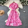 Comercio exterior transfronterizo moda de verano cuello en V estilo francés de un solo pecho vestido estampado de manga corta ceñido a la cintura vestido largo
