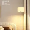 Lámpara de pie Nórdica DIY sala de estar sofá dormitorio tela de moda LED moderno creativo lámpara de pie ambiental arte de hierro