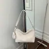 Bolso tejido de nicho súper popular para mujer, nuevo modelo 2026, versátil para el trabajo, bolso de hombro y cruzado, bolso tipo cubo de moda de alta gama