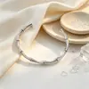 Pulseira Infinito Amor Eterno em Aço Titânio Moda Europeia e Americana Simples Pulseira Aberta Ajustável em Aço Titânio Joia