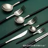 Amazon Acero inoxidable 304 Red social Vajilla Plata Titanio Negro plata Cuchillo para bistec Tenedor Cuchara Set portugués