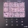 Caja de 12 compartimentos con accesorios populares de arte para uñas transfronterizos, piezas pequeñas de resina, moños idy, accesorios mixtos para decoración de uñas y pedrería
