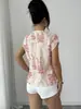 Nuevo top de estampado de tinta transfronterizo europeo y americano con cuello en V, hombros con dobladillo, corte holgado, adecuado para ir al trabajo y para vacaciones, versátil de manga corta