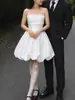 Vestido de novia ligero estilo francés hecho de satén Mikado, sin tirantes, simple y de nicho, con un toque de alta gama, estilo corto, adecuado para fotografía de viajes al aire libre, con una falda voluminosa