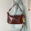 Bolso de mujer vintage de alta gama 2026 modelo nuevo bolso cruzado de gran capacidad bolso de hombro casual para el día a día con colgante para mujer