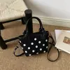 2026 Otoño Temprano Nuevo Exquisito Bolso Cruzado de Lunares para Mujer Bolso de Cubo Vintage de Gamuza de Moda Bolsos para Mujer al por Mayor