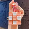 Llavero colgante de Tetris de nueve teclas de moda en colores macaron, accesorio de juguete de botón para aliviar el estrés, venta al por mayor