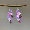 Nuevos ganchos para orejas de mariposa hueca con borla, pendientes dulces, de nicho, elegantes, exquisitos, versátiles con un toque de lujo ligero y de alta gama para mujer