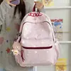 Nuevo modelo 2026 mochila casual estampada estilo ins para estudiantes de secundaria y primaria, mochila ligera de gran capacidad para ir a la escuela para niñas