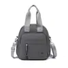 Bolso de Color Sólido 2026 Nuevo Estilo Coreano Bolso de Hombro para Mujer Moderno Bolso Cruzado Mochila Pequeña Mochila de Tela de Nylon para Mujer
