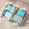 Bolsa de armazenamento para viagem, organizador portátil de roupas e bagagem para viagens de negócios, conjunto de quatro peças à prova d'água de grande capacidade para armazenamento de viagem