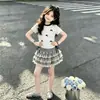 2026 Moderna Camiseta Dulce de Dibujos Animados con Lazo de Manga Corta Falda Linda de Encaje con Pastel Conjunto de Dos Piezas de Verano para Niños Medianos y Mayores