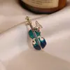 Nuevo Broche de Esmalte Chino Retro Fénix Pipa Abanico Flor Pin Accesorios Hanfu Qipao Broche de Tendencia Nacional