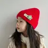 Gorro tejido de lana para otoño e invierno de niños, gorro cálido para bebé de color liso, estilo coreano con flores pequeñas, engrosado para protección contra el frío, adecuado para bebés niños y niñas