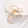 Llavero de Diamantes con 26 Letras Inglesas de Venta Caliente Transfronteriza Estilo Moda Pareja Colgante de Aleación de Zinc con Diamantes Flash para Mochila Escolar de Estudiante