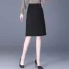 Falda negra para mujer, nuevo estilo primavera y otoño, falda de negocios elegante, falda ajustada con abertura, falda midi