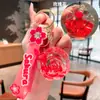 Chaveiro de Garrafa de Areia Líquida Boneca Rosa Óleo Tendência para Mulheres, Acessório de Mochila com Pingente de Rosa Cartoon Fofo Exquisito