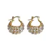 Celebridad de internet personalizado elegante moda súper brillante diamante cesta de flores hebilla de oreja femenina estilo francés diseño de nicho sentido de diseño estilo occidental pendientes de lujo ligero