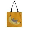 Directo de fábrica estilo coreano bolso de hombro práctico de dibujos animados moda versátil bolsa de mano lindo gato estampado bolsa de compras