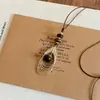 Collar Colgante de Ojo de Tigre Retro Forma de Gota de Agua Cadena de Suéter Sencilla de Moda de Gama Alta Nicho Versátil Otoño e Invierno para Mujer