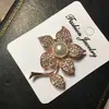 Versión coreana de broche de tulipán de perla de diamante de alta gama, alfiler de moda para mujer, corsage, broche de flor, venta al por mayor, personalizado