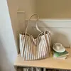 Bolsa de lona listrada da moda para mulheres 2026 novo modelo bolsa tote de grande capacidade bolsa de ombro casual para o dia a dia de grande capacidade
