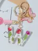 Suministros del Fabricante Llaveros con Flores Secas Prensadas 26 Letras del Alfabeto Inglés Llaveros con Borla de Mariposa Charms para Bolsos de Mujer